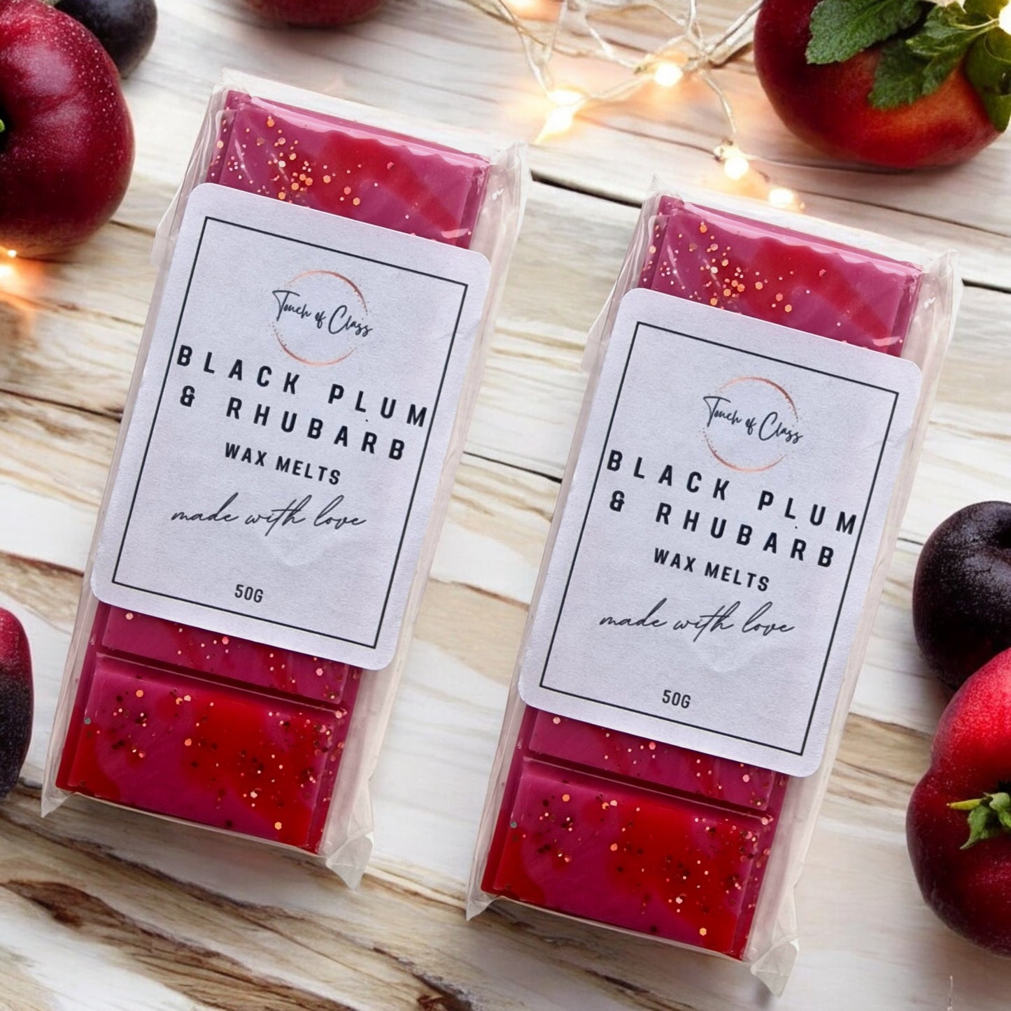 A close up of Black Plum & Rhubarb wax melts by Touch of Class.  The wax melt is in the shape of a snap bar