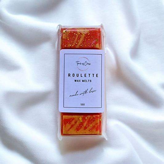A close up photo of Roulette wax melts by touch of class.  The wax melt is in the shape of a snap bar