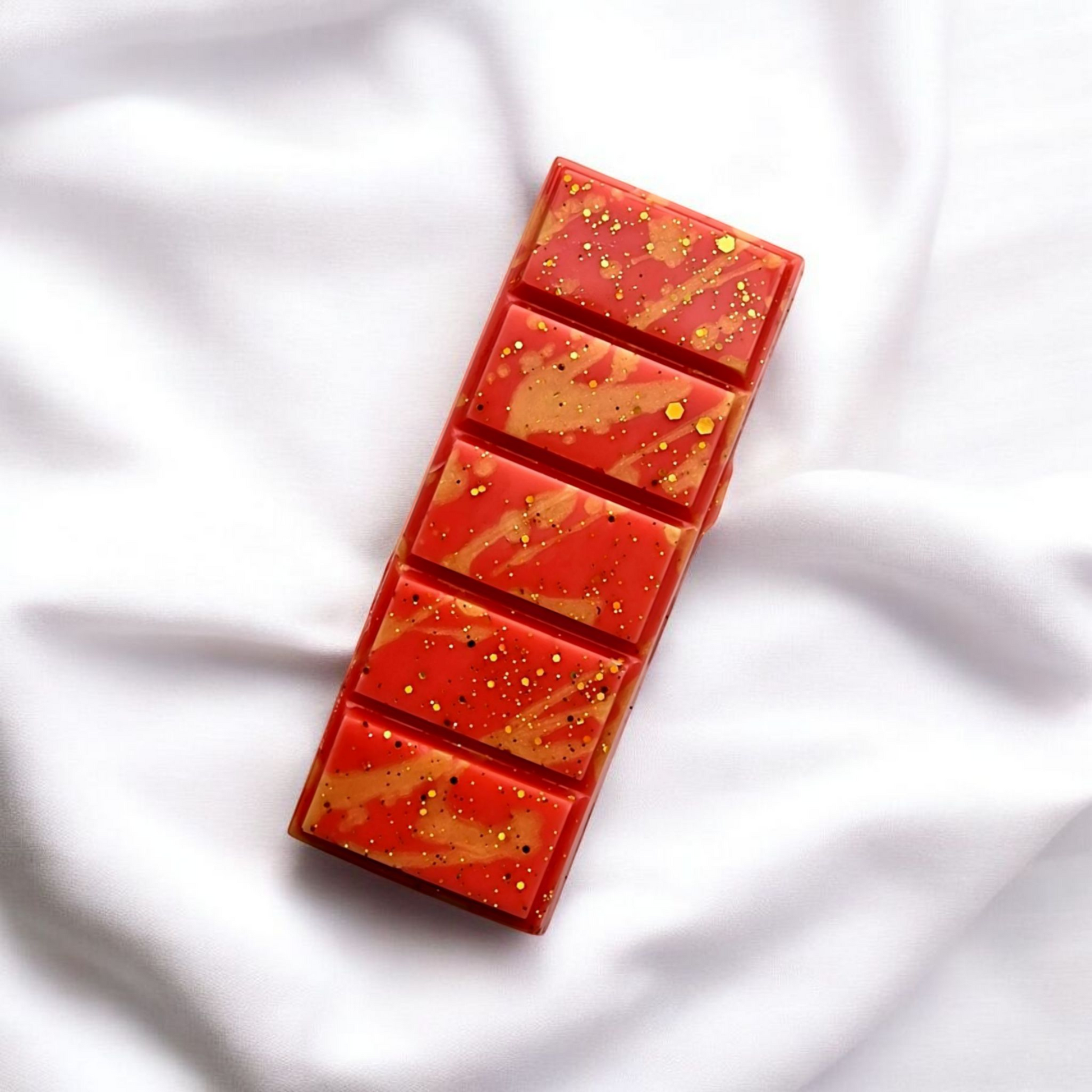 A close up photo of Roulette wax melts by touch of class.  The wax melt is in the shape of a snap bar